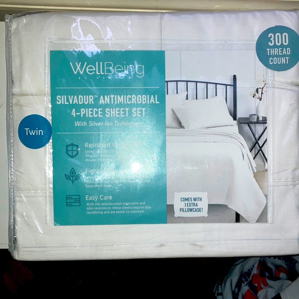 Twin 4 piece sheet set , white, “anti-microbial”. Never opened/used